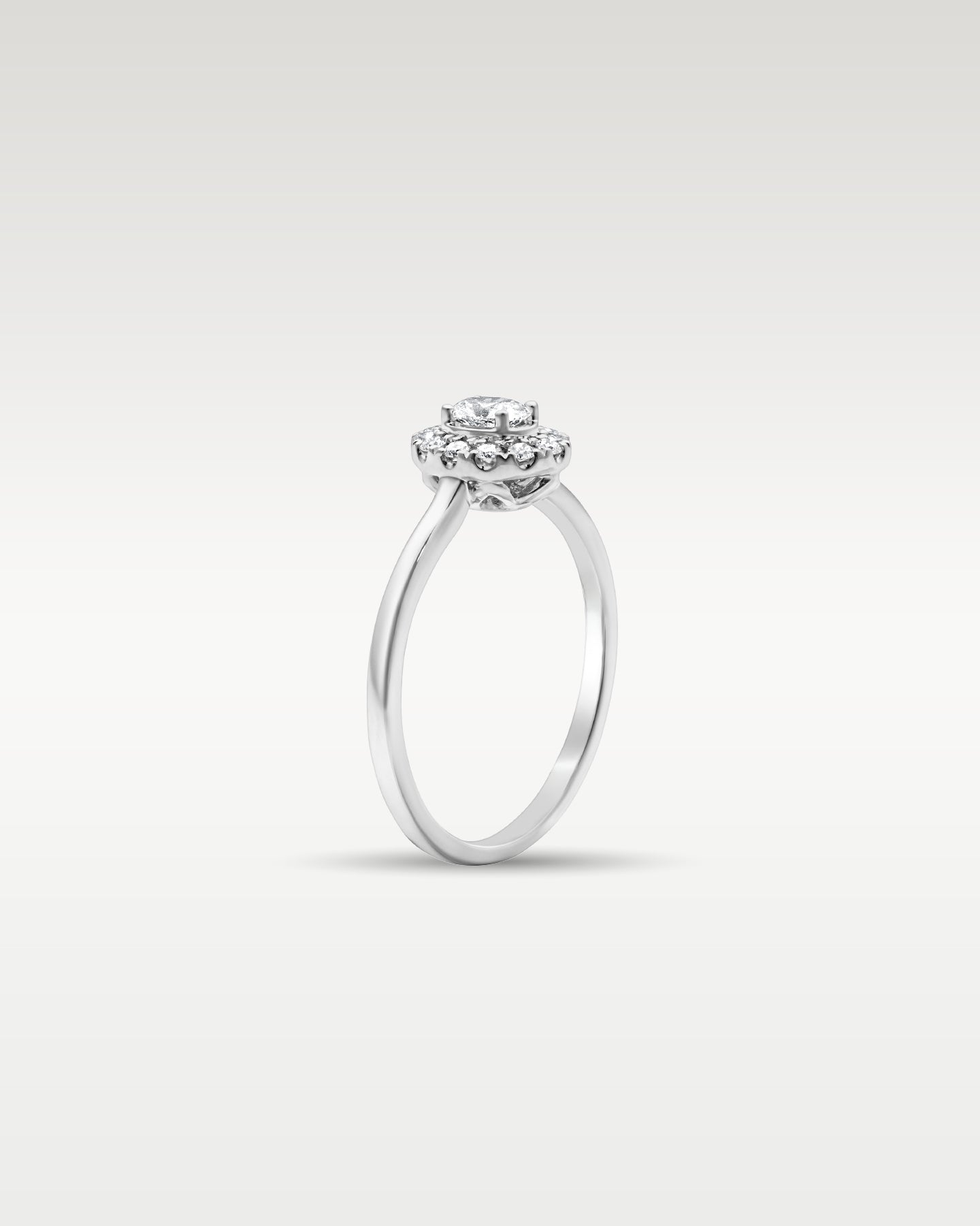 18k White Gold Oval Halo Diamond Engagement Ring | Noah’s Fine Jewelry Dallas