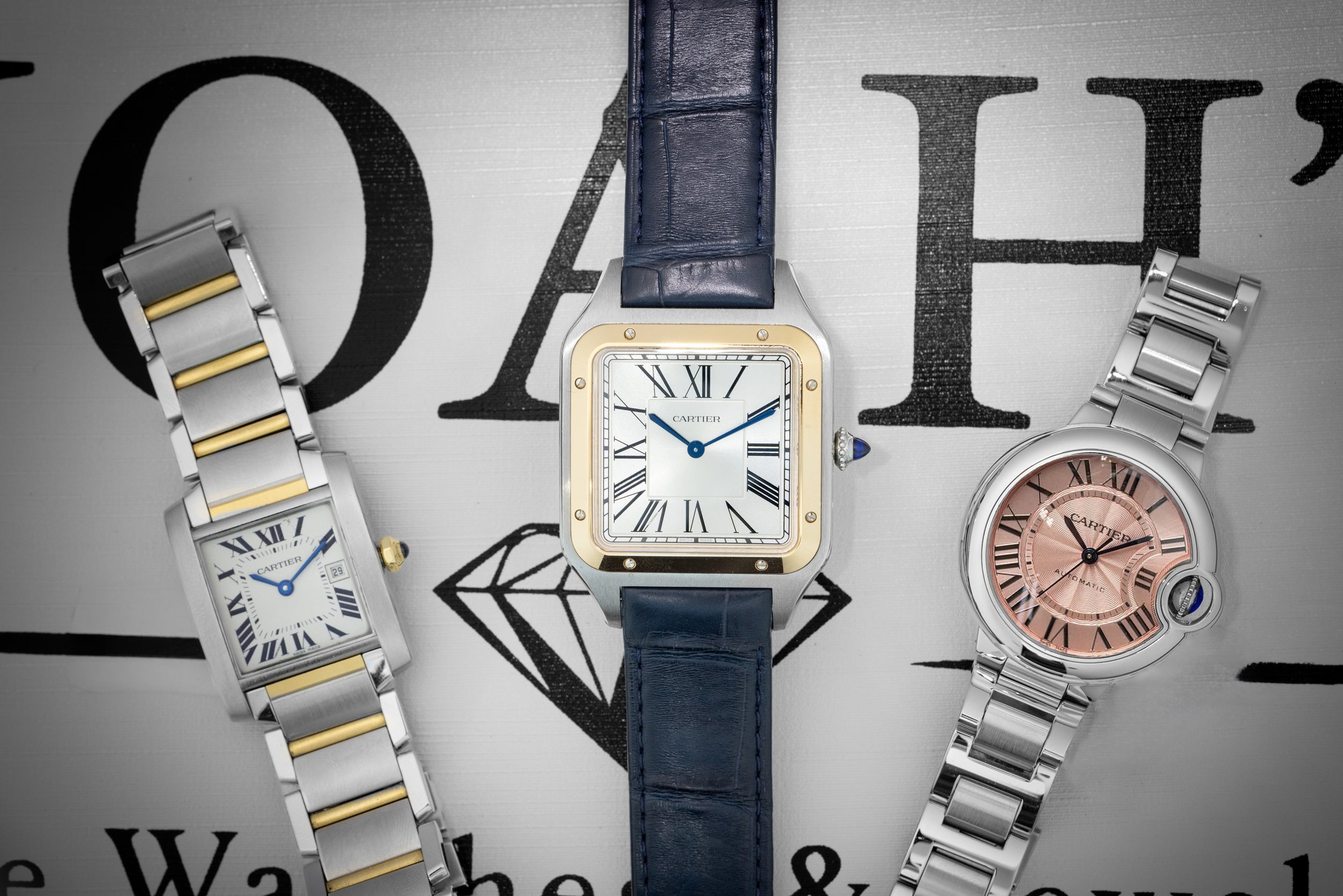 A trio of classic luxury Cartier watches including a two-tone Tank Française, a gold and steel Santos de Cartier on a leather strap, and a pink dial Ballon Bleu