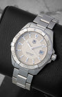 Front angled view of a stainless steel TAG Heuer Aquaracer 300M quartz men's watch in Dallas