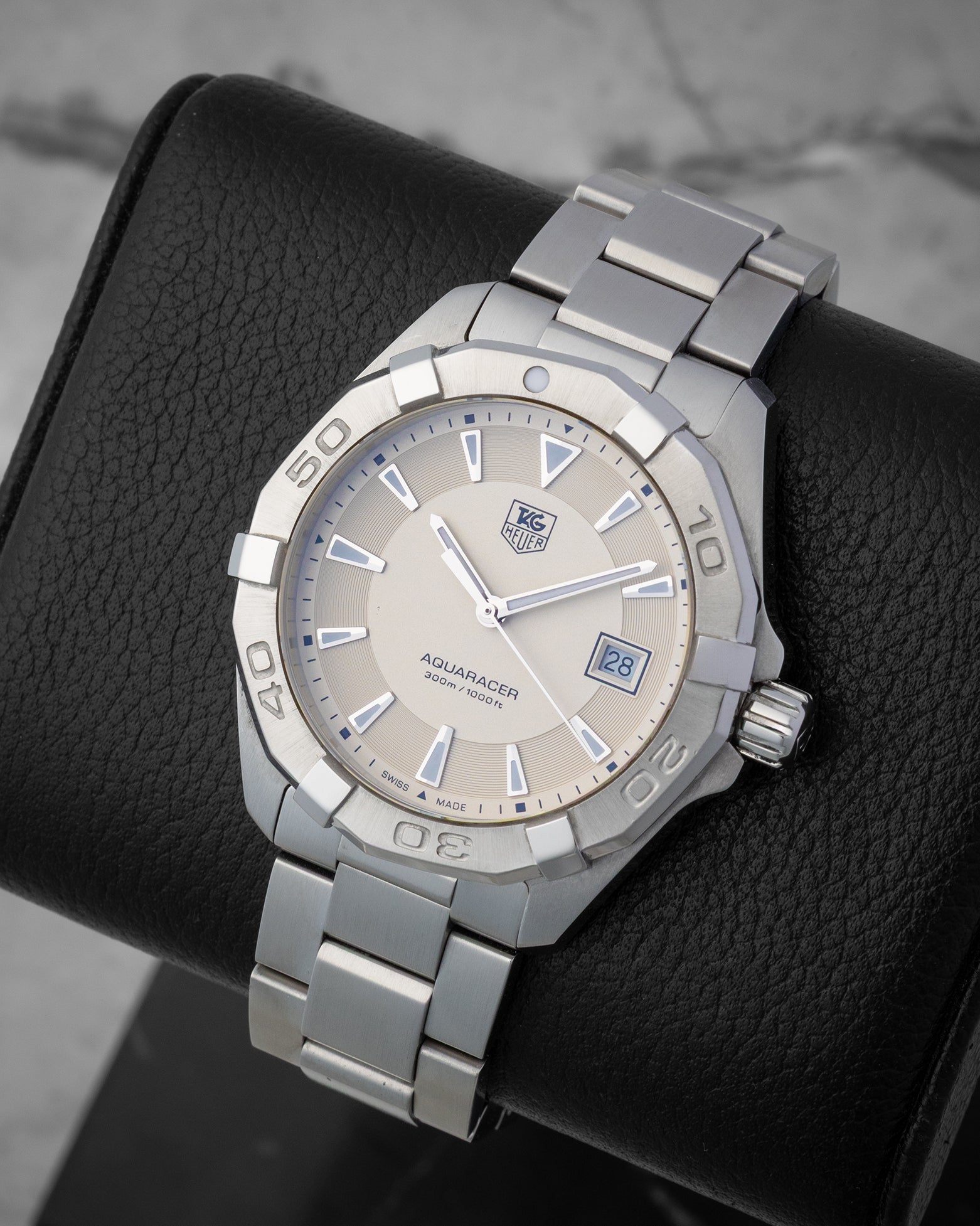 Front angled view of a stainless steel TAG Heuer Aquaracer 300M quartz men's watch in Dallas