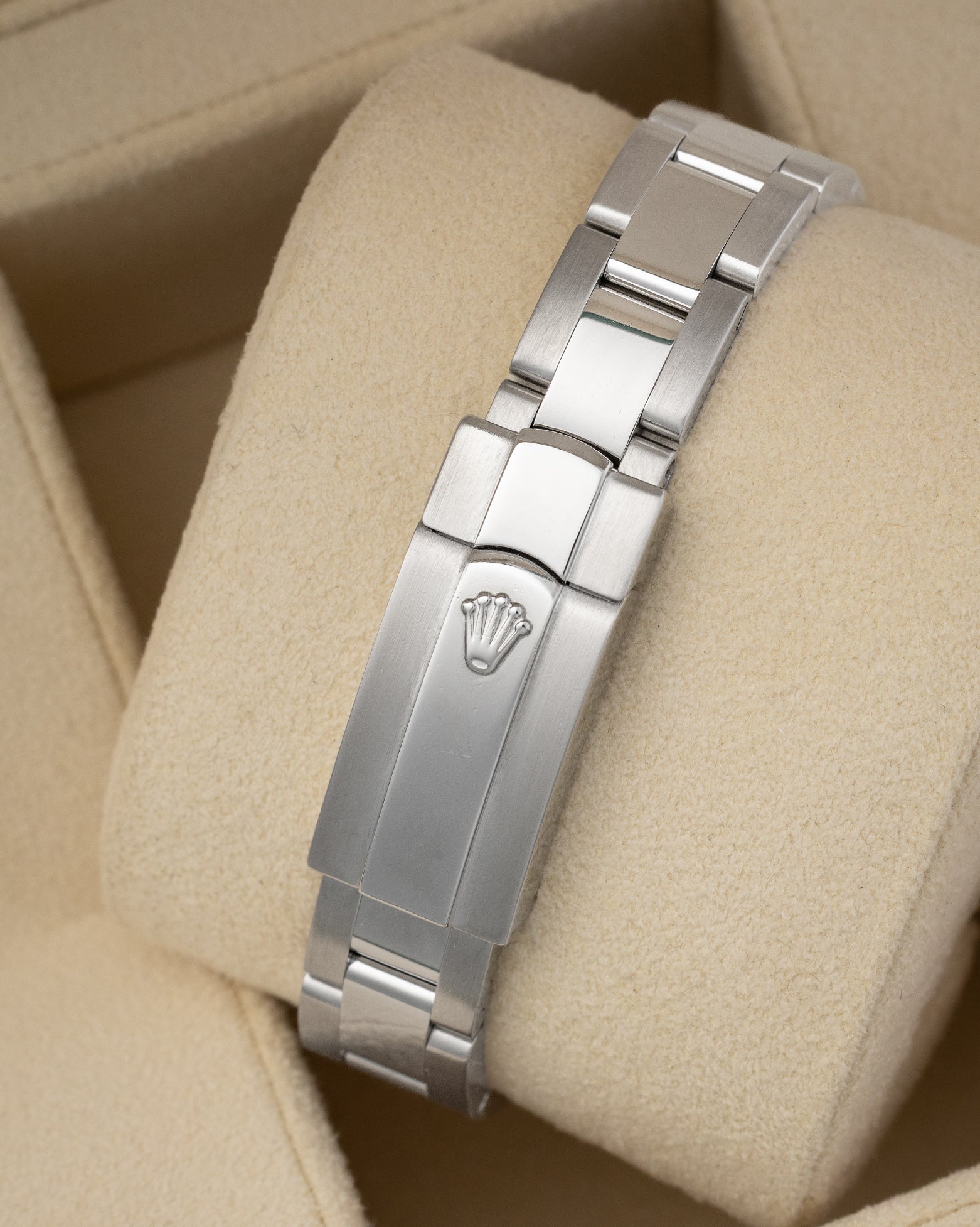 rear view snapshot focusing on the brushed stainless steel three-link Oyster bracelet and its folding Oysterclasp closure with embossed crown