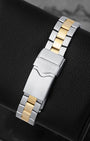 Rear view of the two-tone steel and yellow gold-plated link bracelet showing the folding deployment clasp with safety lever stamped with the TAG Heuer shield logo