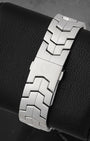 Rear view of the iconic satin-finished interlocking S-shape metal link bracelet focusing on the flush and secure low-profile folding safety clasp stamped with the Heuer shield