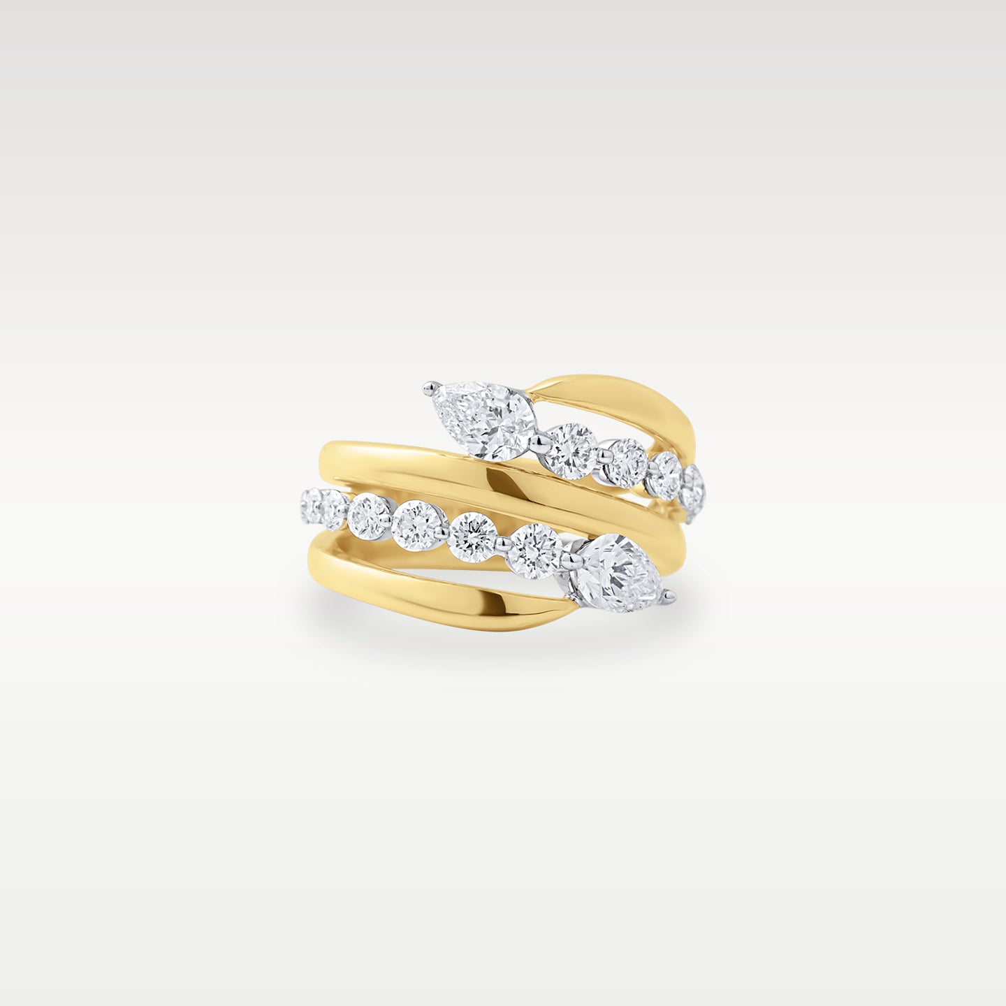 Front view of a 14k yellow gold wrap ring set with pear and round brilliant diamonds totaling 1.67 carats