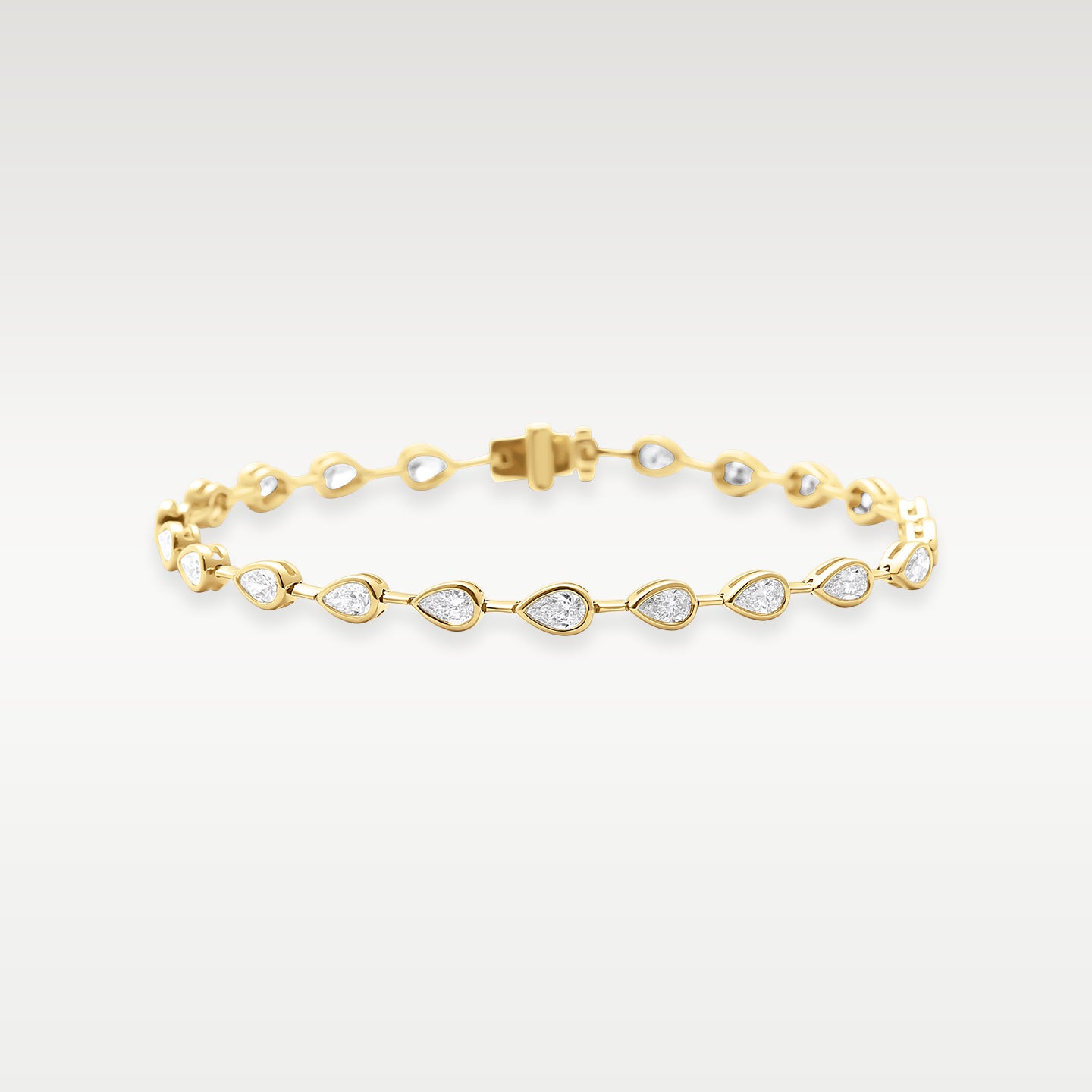 Yellow Gold Bezel Set Pear Diamond Tennis Bracelet | Noah's Fine Watches & Jewelry DFW
