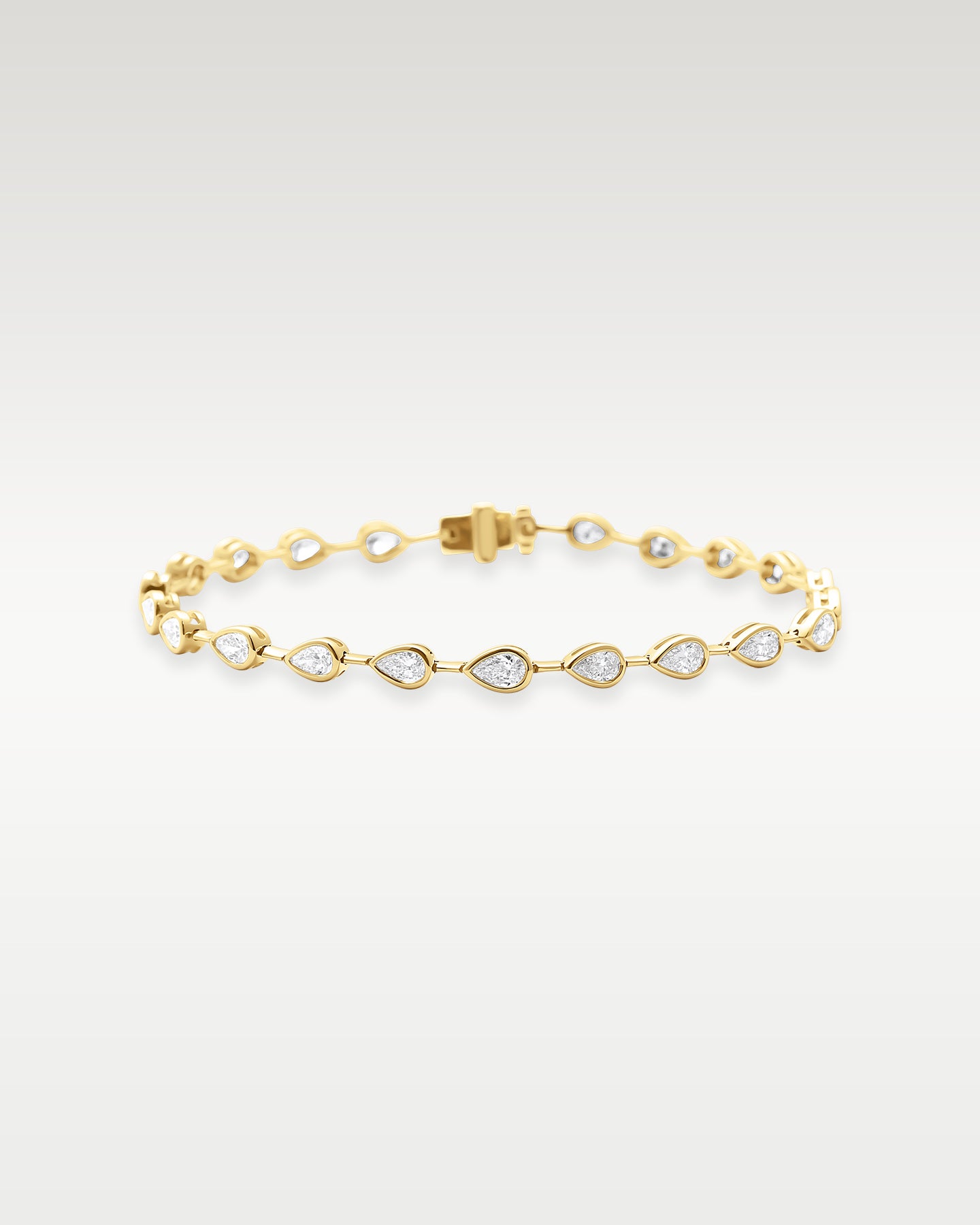 Yellow Gold Bezel Set Pear Diamond Tennis Bracelet | Noah's Fine Watches & Jewelry DFW