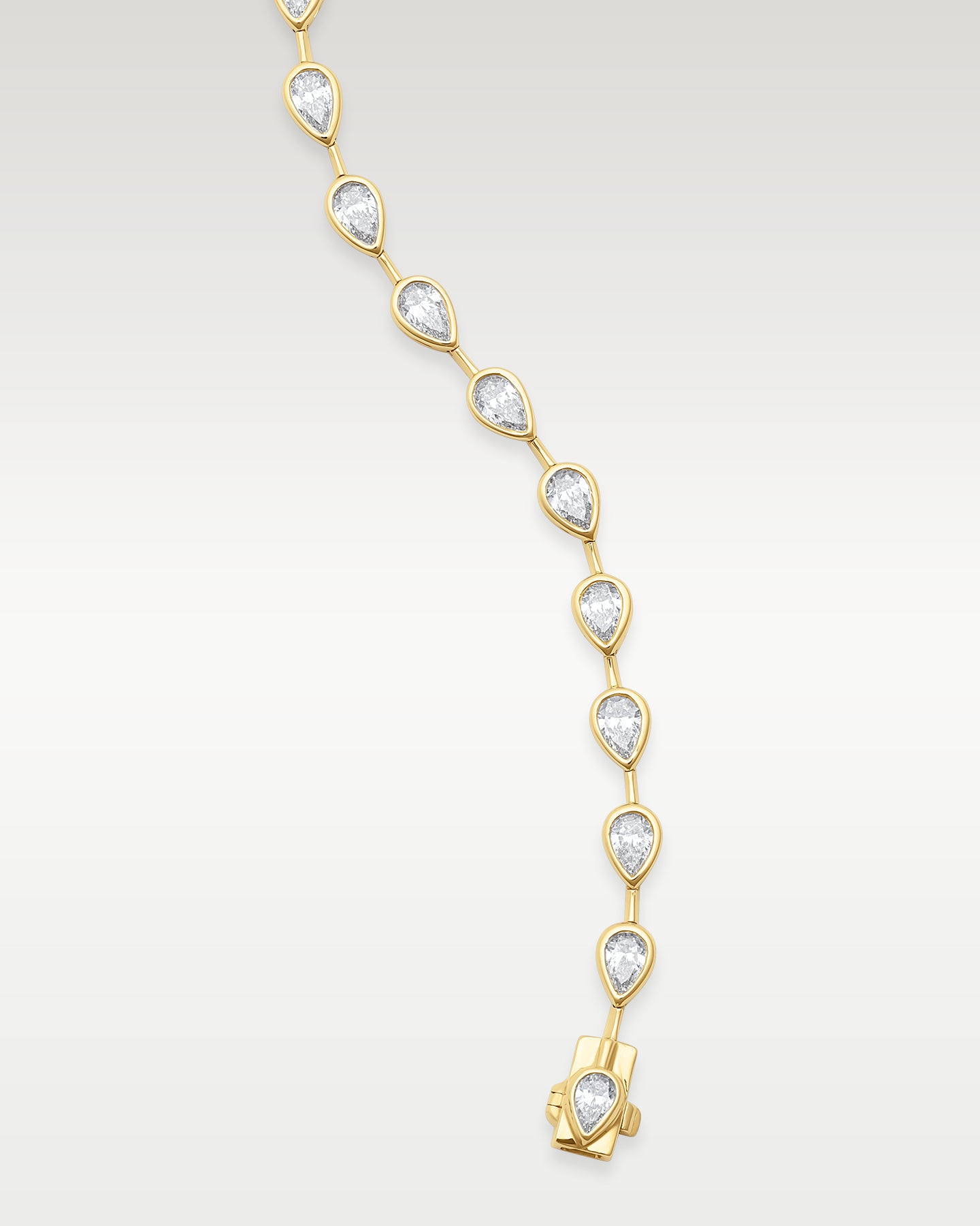 Yellow Gold Bezel Set Pear Diamond Tennis Bracelet | Noah's Fine Watches & Jewelry DFW