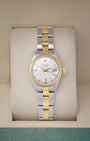 Vintage 1969 two-tone Rolex Oyster Perpetual Date 6517 with a sunburst silver dial and gold fluted bezel in a Rolex watch box