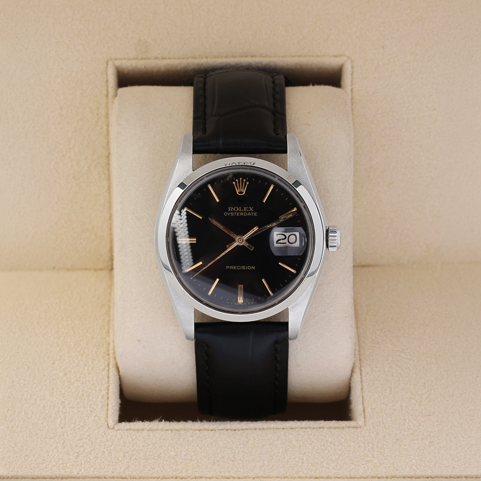 Vintage 1987 Rolex Oysterdate Precision 6694 with a black gilt dial and black leather strap resting inside a Rolex box