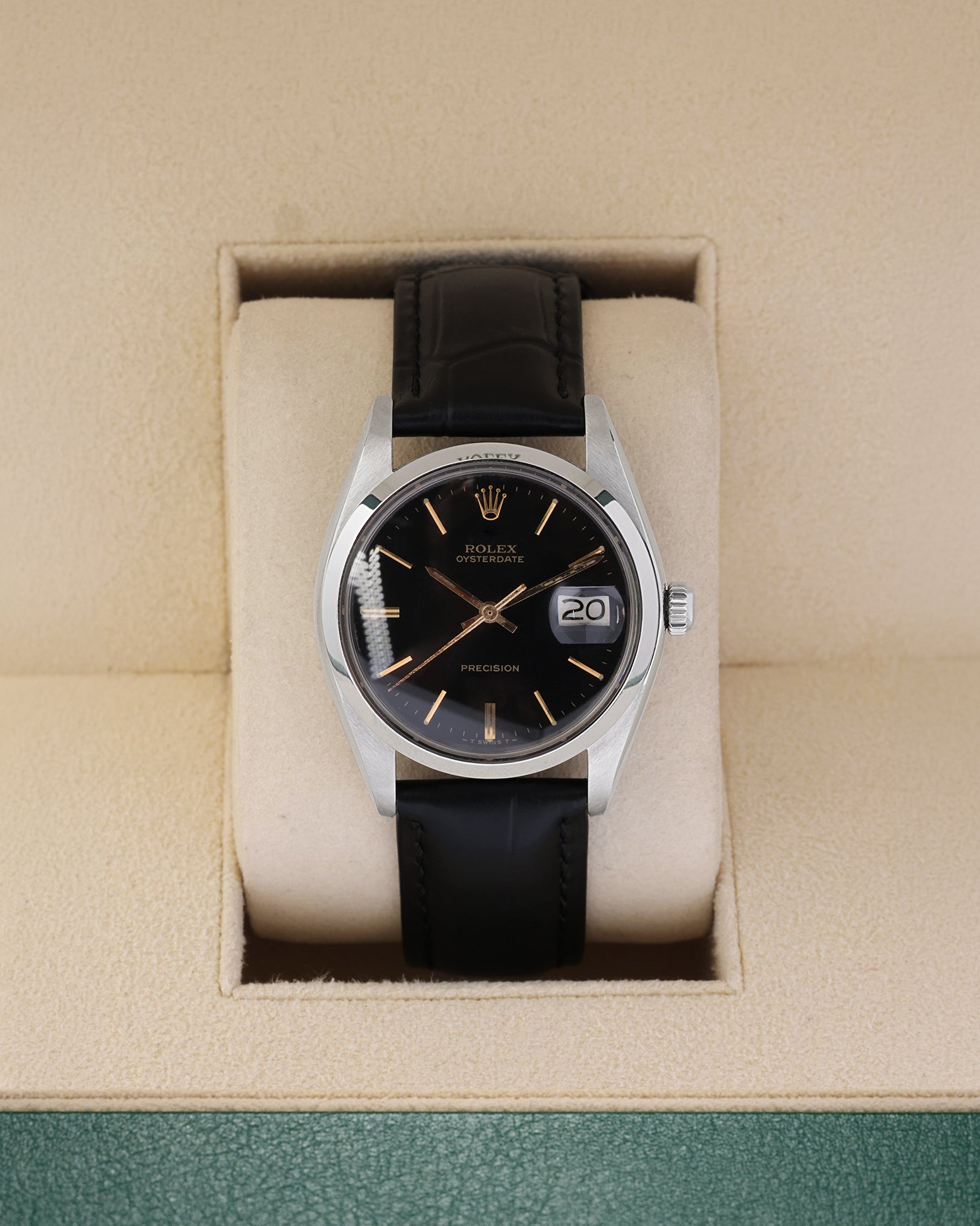 Vintage 1987 Rolex Oysterdate Precision 6694 with a black gilt dial and black leather strap resting inside a Rolex box