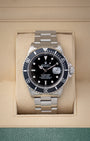 Preowned 1999 Rolex Submariner Date 40mm reference 16610 with black dial, aluminum bezel, and stainless steel Oyster bracelet at Noahs Fine Watches and Jewelry in Dallas TX