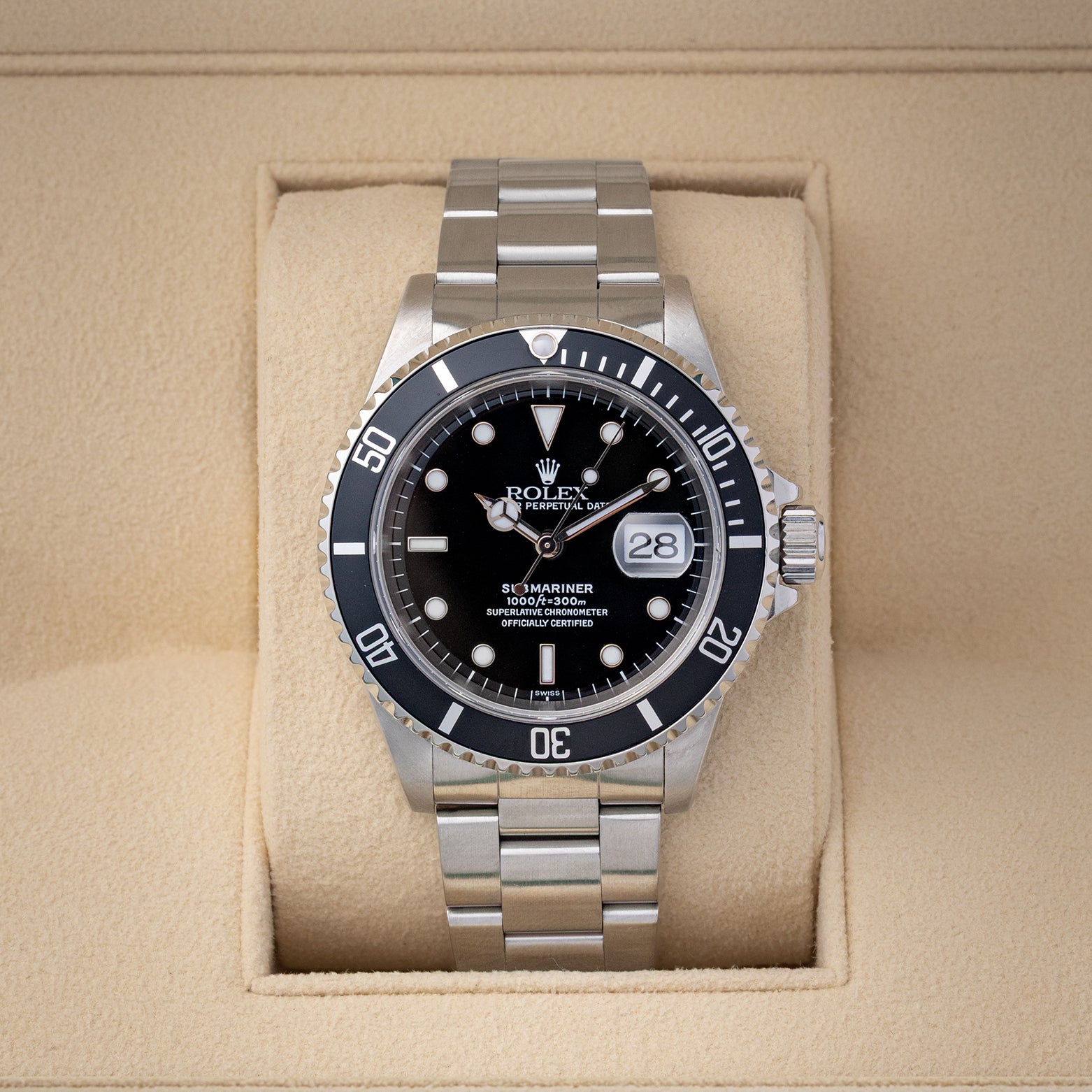 Preowned 1999 Rolex Submariner Date 40mm reference 16610 with black dial, aluminum bezel, and stainless steel Oyster bracelet at Noahs Fine Watches and Jewelry in Dallas TX