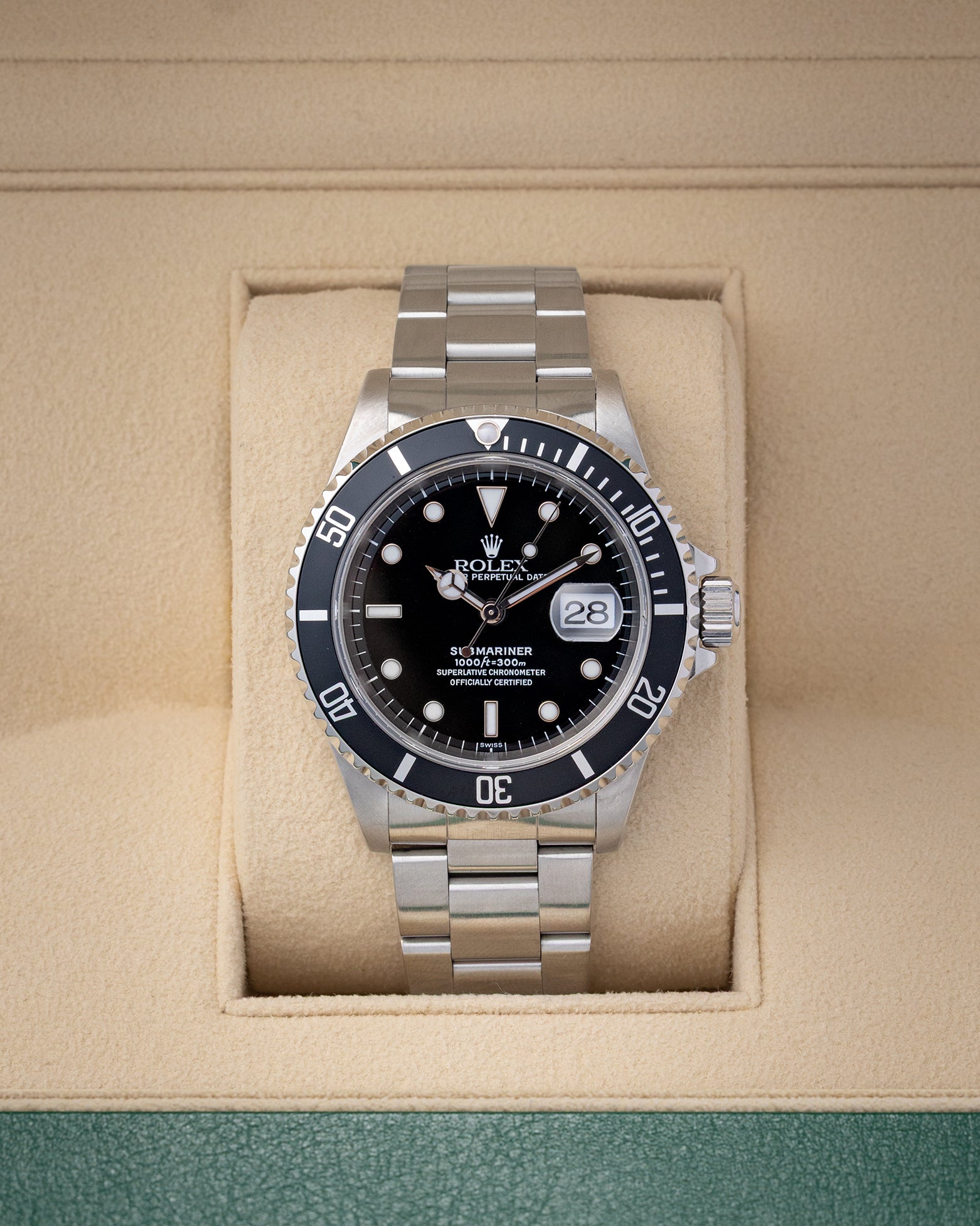 Preowned 1999 Rolex Submariner Date 40mm reference 16610 with black dial, aluminum bezel, and stainless steel Oyster bracelet at Noahs Fine Watches and Jewelry in Dallas TX