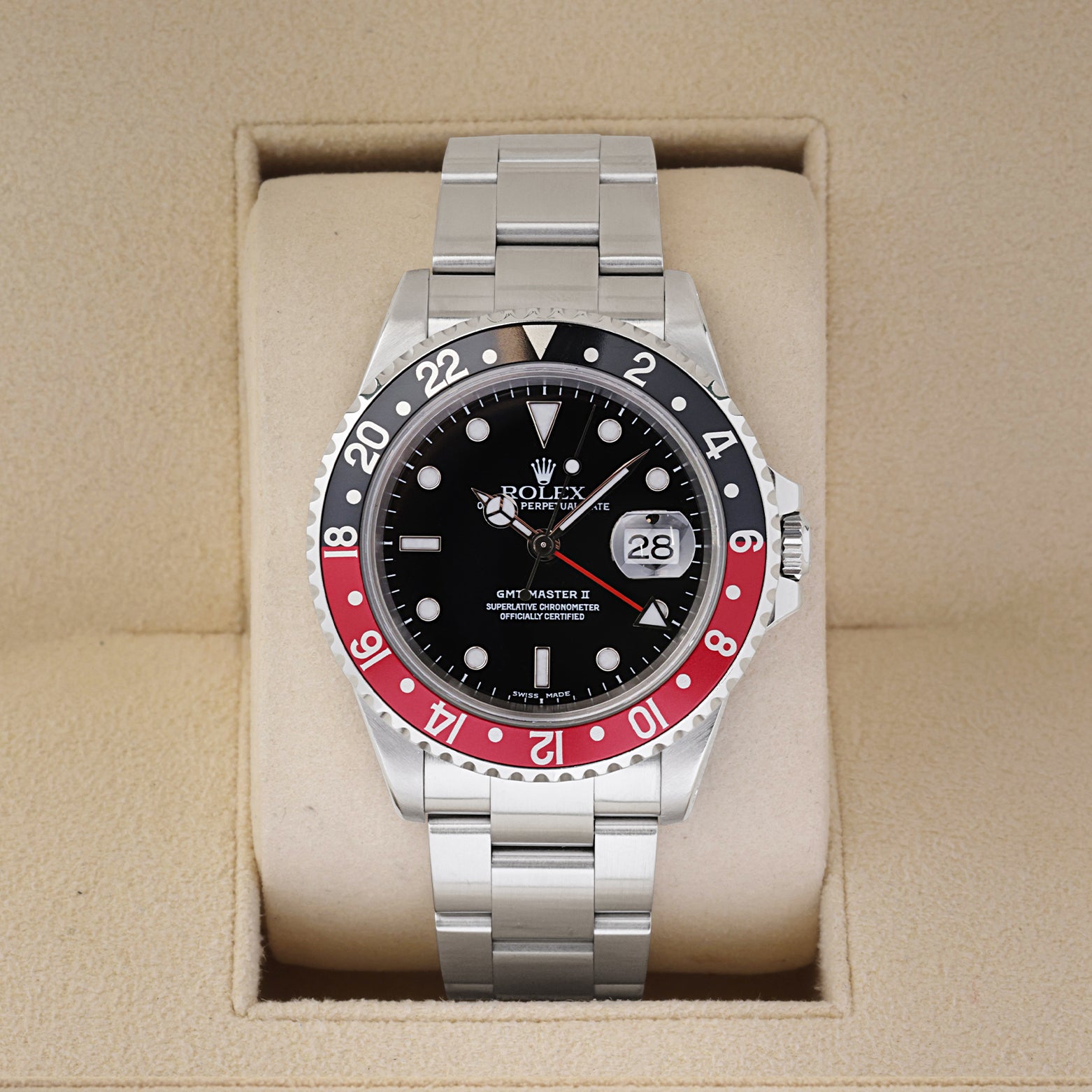 2000 Rolex GMT-Master II 16710 luxury watch with a black and red Coke bezel insert inside a Rolex presentation box