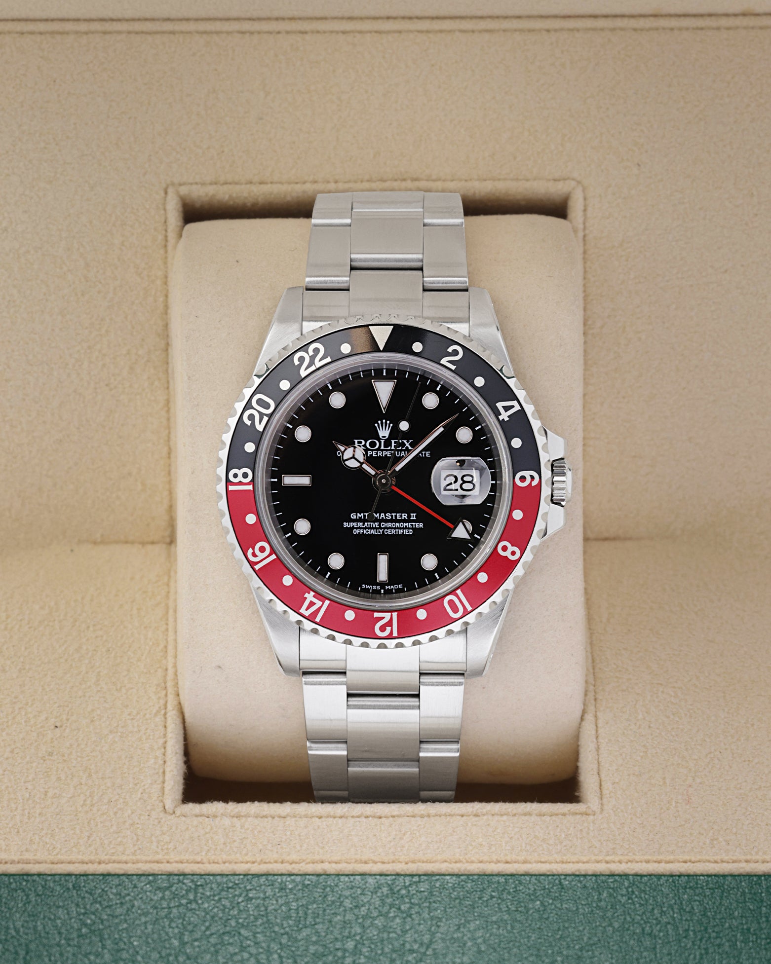 2000 Rolex GMT-Master II 16710 luxury watch with a black and red Coke bezel insert inside a Rolex presentation box