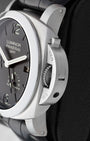 Side profile detail showing the 44mm stainless steel cushion case and iconic Panerai safety lock crown guard lever on reference PAM00321