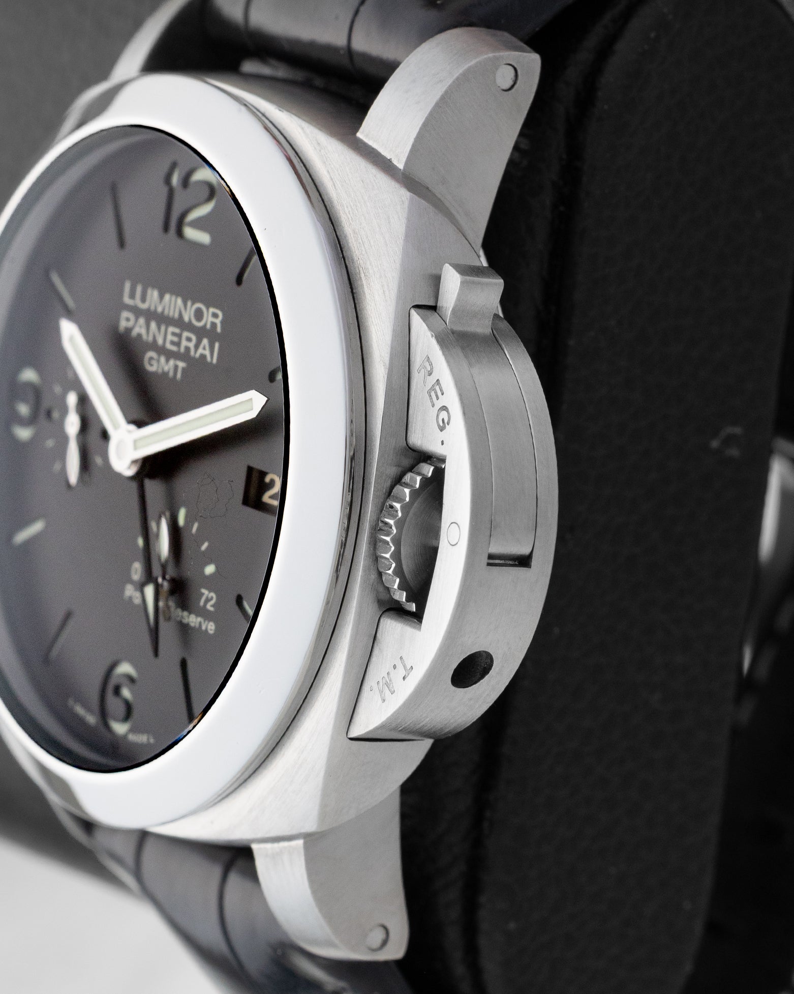 Side profile detail showing the 44mm stainless steel cushion case and iconic Panerai safety lock crown guard lever on reference PAM00321