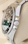 Side profile detail showing the 40mm stainless steel case, crown guards, and signed Triplock winding crown on a Rolex GMT-Master II 116710LN