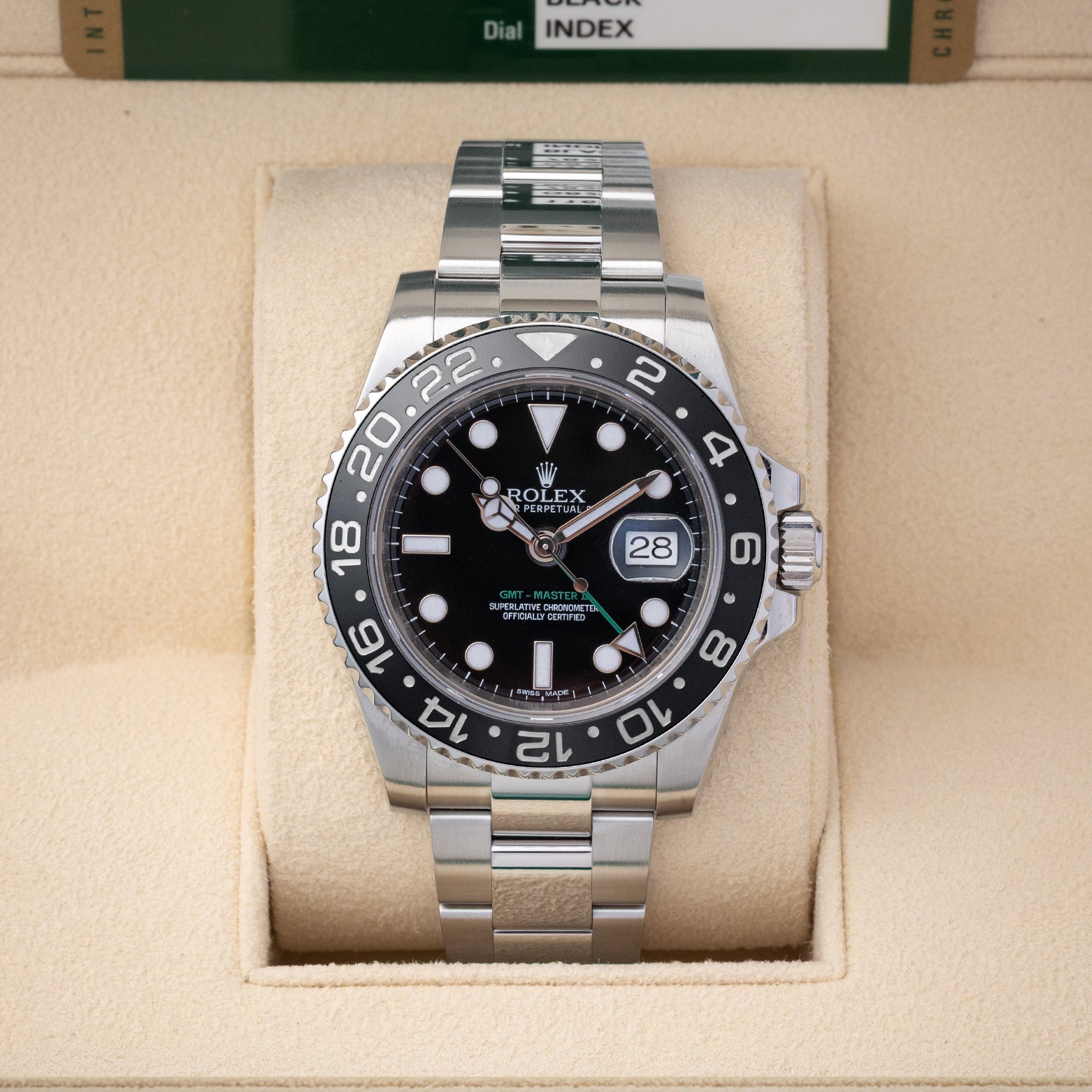 Preowned 2013 Rolex GMT-Master II 40mm reference 116710LN with black dial, green GMT hand, black Cerachrom bezel, and stainless steel Oyster bracelet at Noahs Fine Watches and Jewelry in Dallas TX