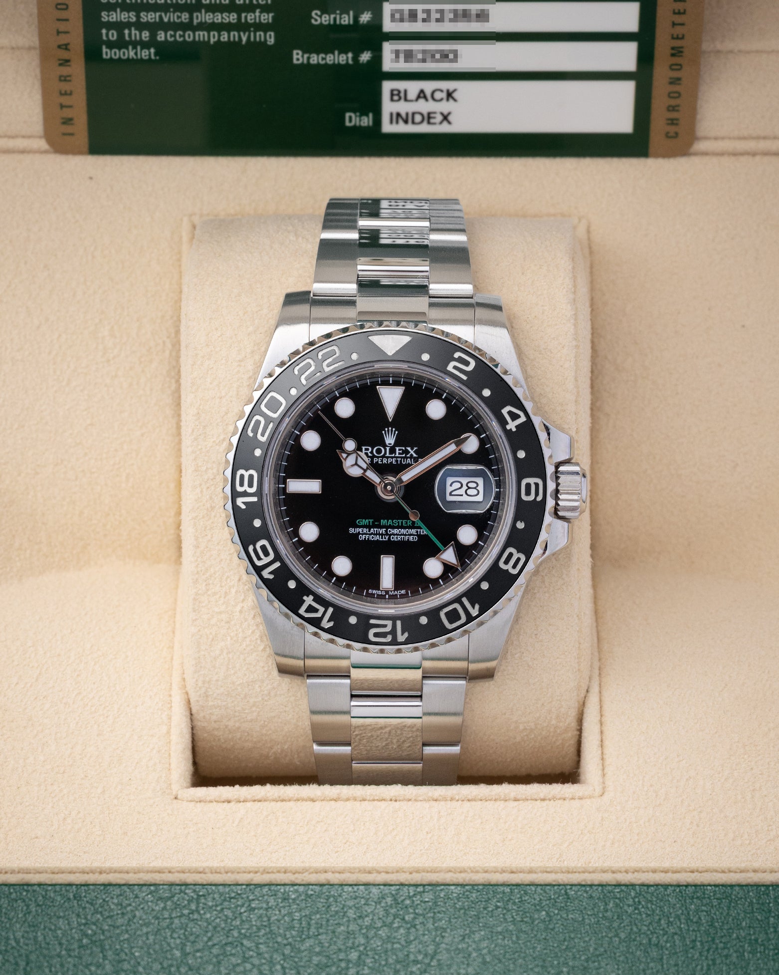 Preowned 2013 Rolex GMT-Master II 40mm reference 116710LN with black dial, green GMT hand, black Cerachrom bezel, and stainless steel Oyster bracelet at Noahs Fine Watches and Jewelry in Dallas TX