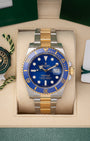 Pre-owned 2018 Rolex Submariner Date 40mm reference 116613LB two-tone yellow gold and stainless steel watch with royal blue dial at Noahs Fine Watches and Jewelry in Dallas TX