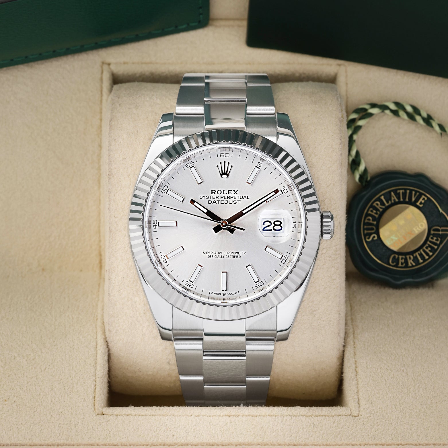 Preowned 2019 Rolex Datejust 41 126334 luxury watch featuring a sunray silver baton dial and solid 18k white gold fluted bezel at Noah's Fine Watches and Jewelry in Dallas