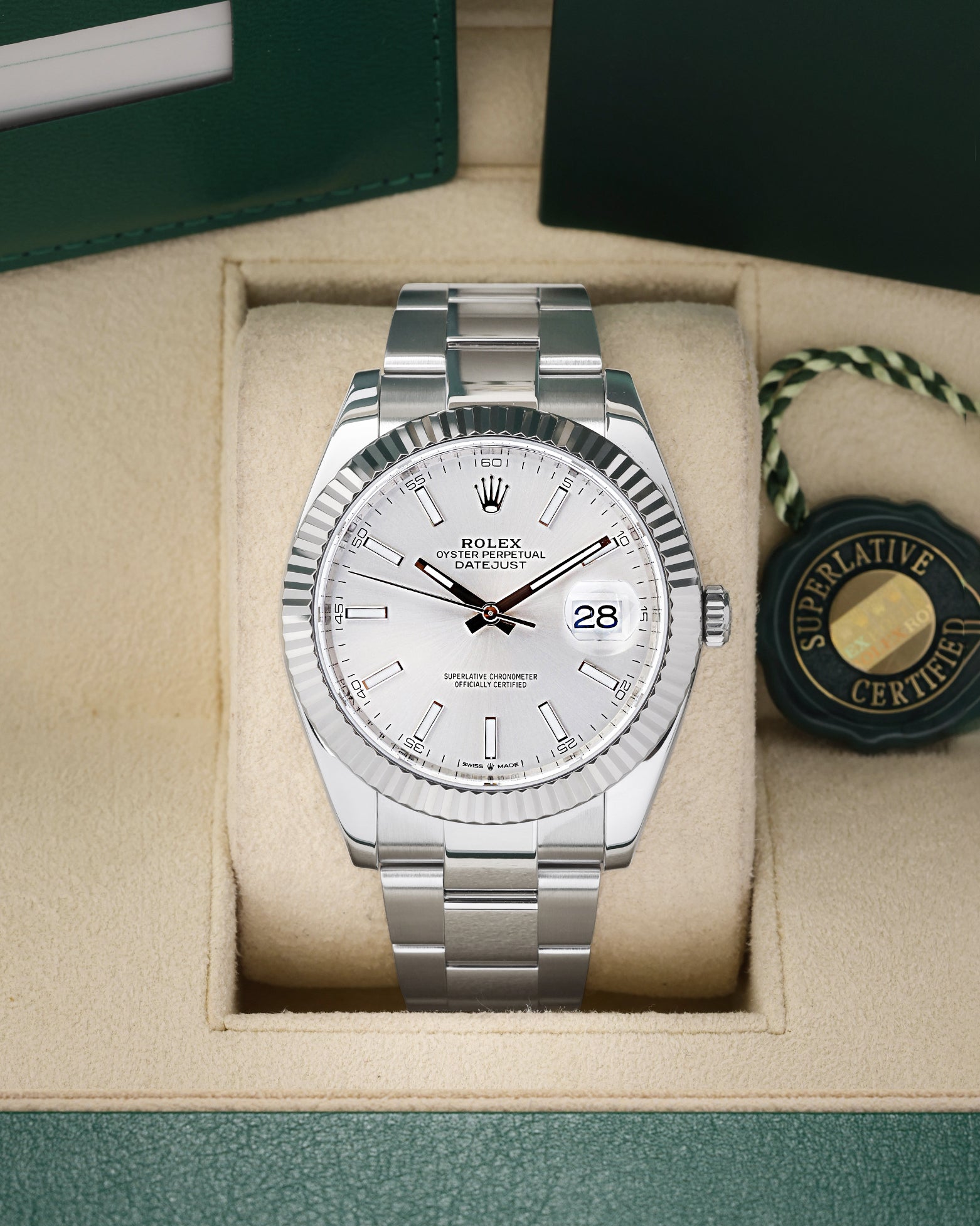 Preowned 2019 Rolex Datejust 41 126334 luxury watch featuring a sunray silver baton dial and solid 18k white gold fluted bezel at Noah's Fine Watches and Jewelry in Dallas
