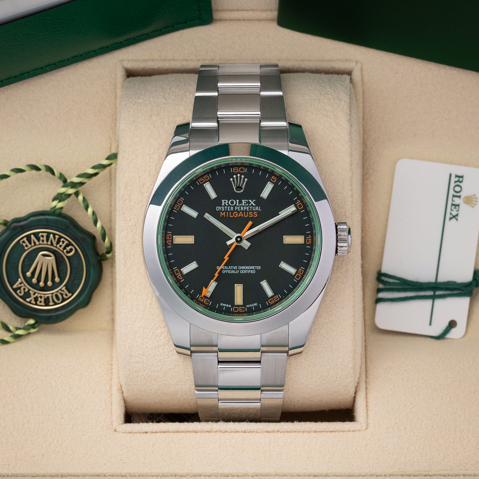Pre owned 2019 Rolex Milgauss 40mm reference 116400GV with black dial, orange lightning bolt hand, green sapphire crystal, and Oyster bracelet at Noahs Fine Watches and Jewelry in Dallas TX