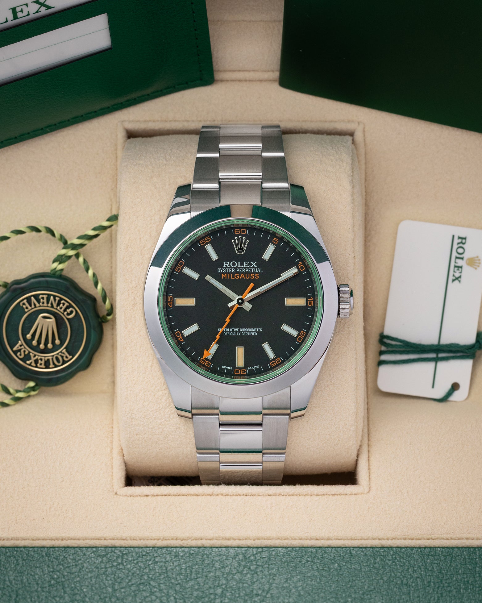 Pre owned 2019 Rolex Milgauss 40mm reference 116400GV with black dial, orange lightning bolt hand, green sapphire crystal, and Oyster bracelet at Noahs Fine Watches and Jewelry in Dallas TX
