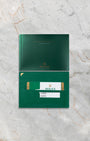 Official Rolex international guarantee card, green leather holder, and Milgauss user manual for reference 116400GV