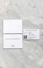 The official printed IWC international warranty card dated 2022, shown alongside the user manuals and registration documents at Noahs Fine Watches and Jewelry Dallas