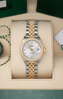 Preowned 2022 Rolex Lady-Datejust 28mm reference 279383RBR two-tone yellow gold and stainless steel watch with factory diamond bezel and silver diamond dial at Noahs Fine Watches and Jewelry in Dallas TX