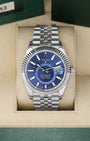 Pre owned 2023 Rolex Sky-Dweller 326934 White Rolesor steel watch with an 18k white gold fluted bezel and bright blue dial at Noah's Fine Watches and Jewelry Dallas Texas