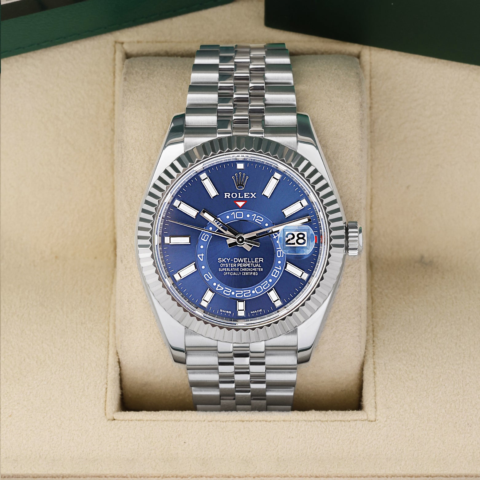 Pre owned 2023 Rolex Sky-Dweller 326934 White Rolesor steel watch with an 18k white gold fluted bezel and bright blue dial at Noah's Fine Watches and Jewelry Dallas Texas