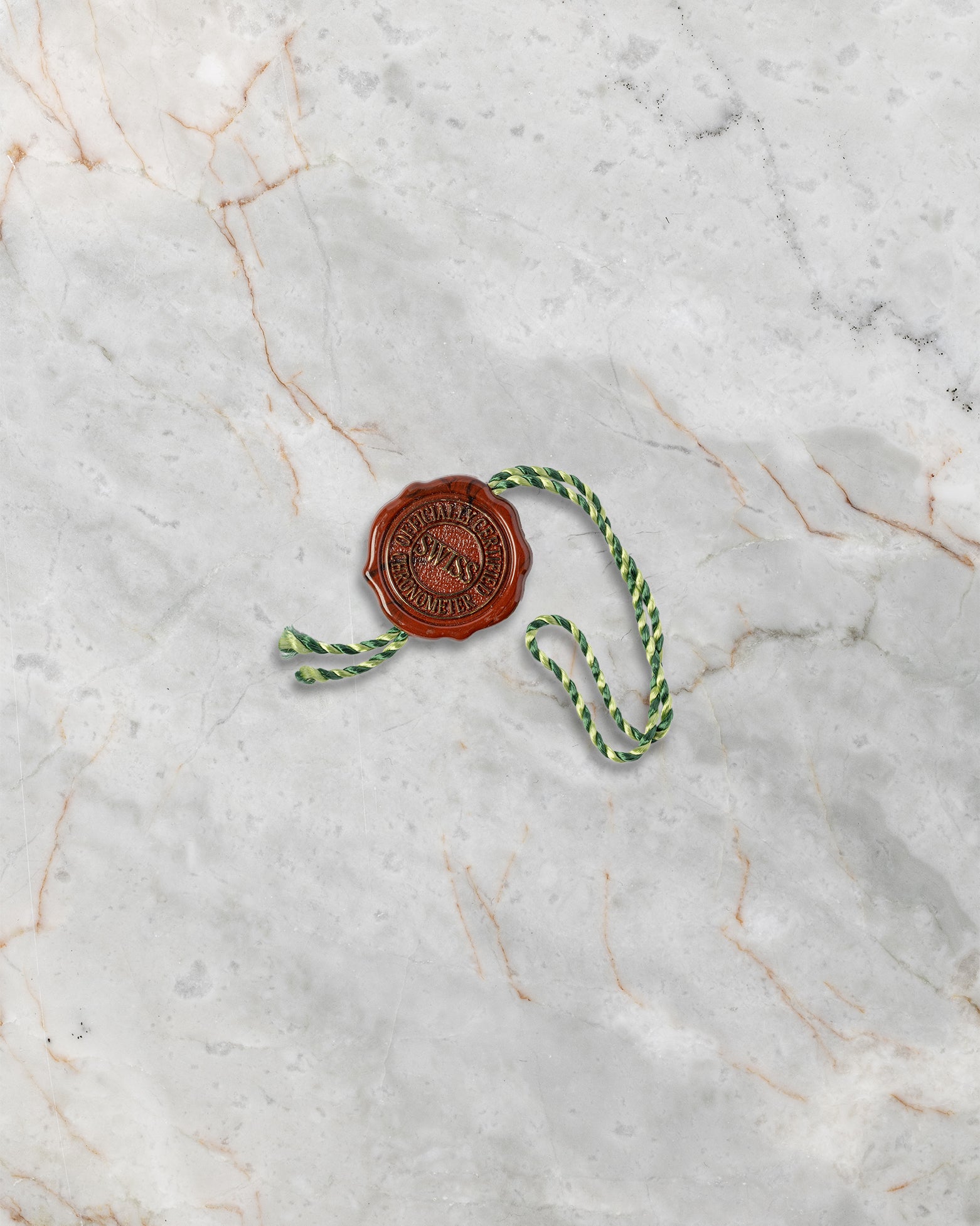 Official green Rolex Superlative Chronometer seal hang tag included with the two-tone Sky-Dweller 336933 watch set