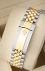 Rear perspective of the five-piece link Yellow Rolesor Jubilee bracelet and folding Oysterclasp featuring the embossed Rolex crown logo