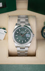 Preowned 2024 Rolex Datejust 36 126200 stainless steel watch with smooth bezel and sunray mint green dial at Noah's Fine Watches and Jewelry Dallas Texas