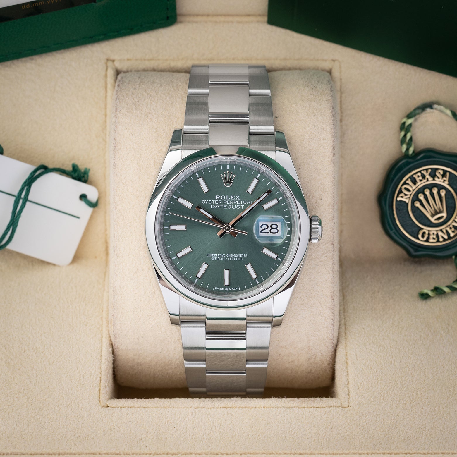 Preowned 2024 Rolex Datejust 36 126200 stainless steel watch with smooth bezel and sunray mint green dial at Noah's Fine Watches and Jewelry Dallas Texas
