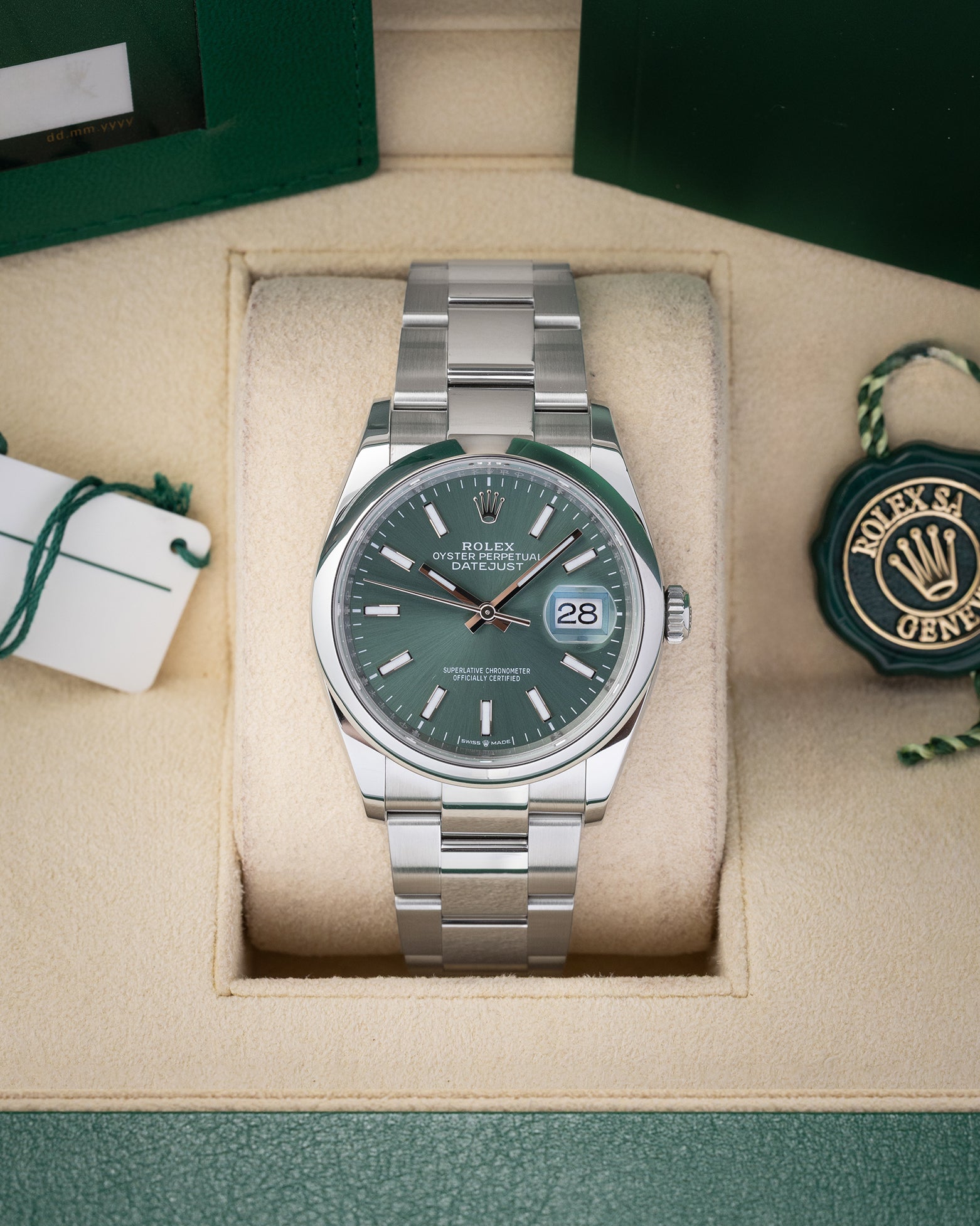 Preowned 2024 Rolex Datejust 36 126200 stainless steel watch with smooth bezel and sunray mint green dial at Noah's Fine Watches and Jewelry Dallas Texas