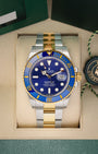 2024 Rolex Submariner Date "Bluesy" 41mm watch in two-tone yellow gold and steel, model 126613LB, on display at Noah's Fine Watches & Jewelry in Dallas