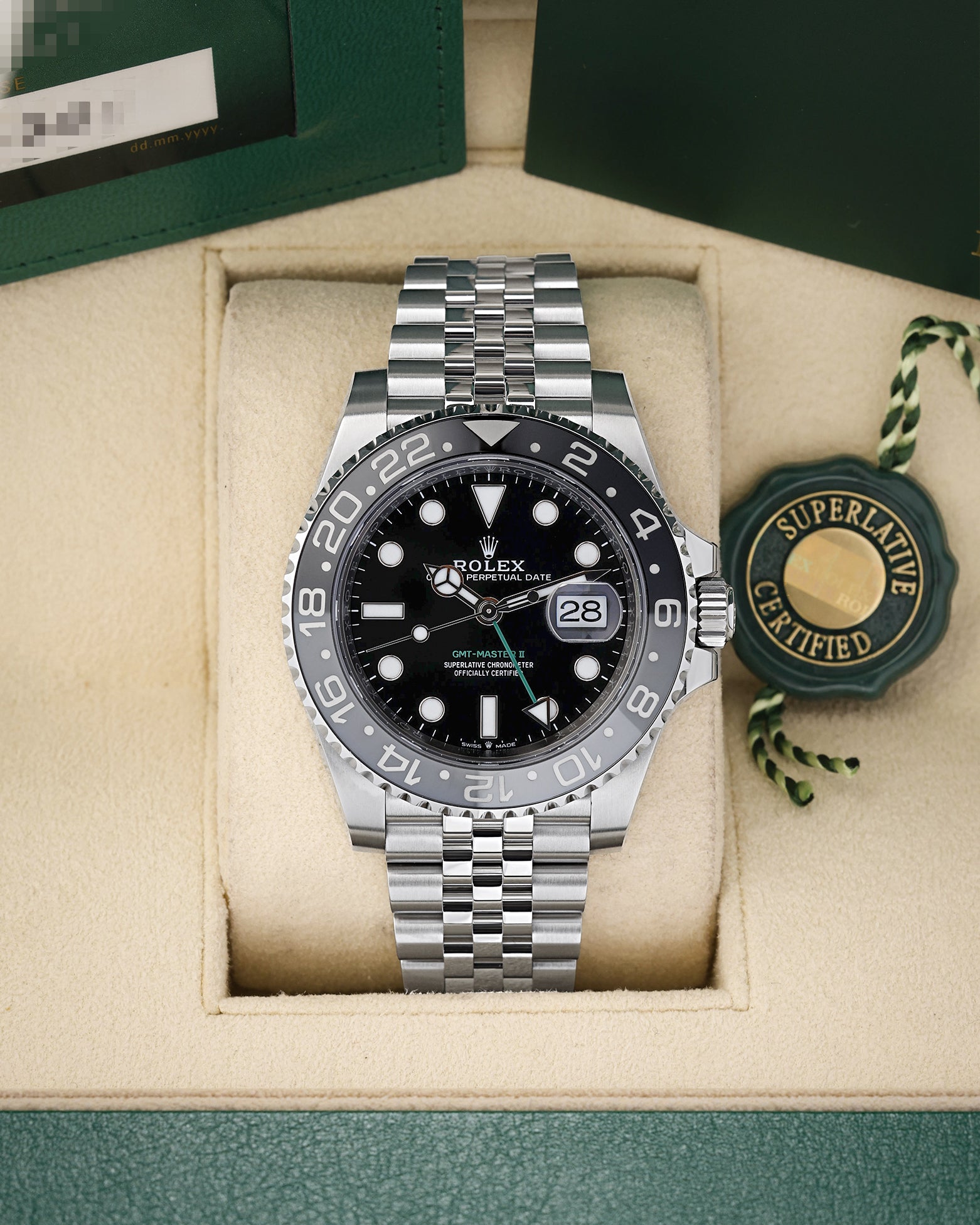 Preowned 2025 Rolex GMT-Master II 126710GRNR Oystersteel watch with grey and black ceramic bezel and green GMT hand on a Jubilee bracelet at Noah's Fine Watches and Jewelry Dallas Texas
