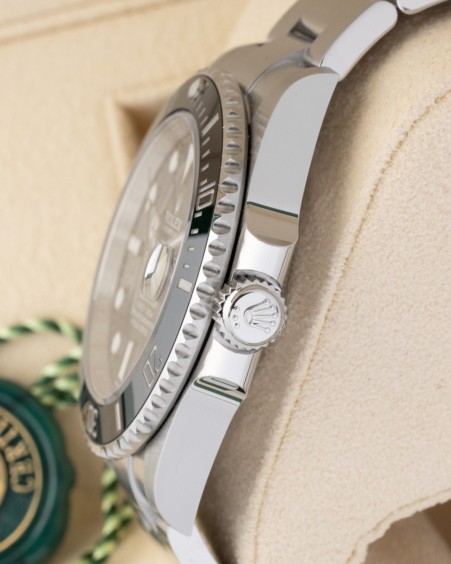 Side profile detail showing the 41mm stainless steel case, crown guards, and signed Triplock crown on a 2025 Rolex Submariner Date 126610LN