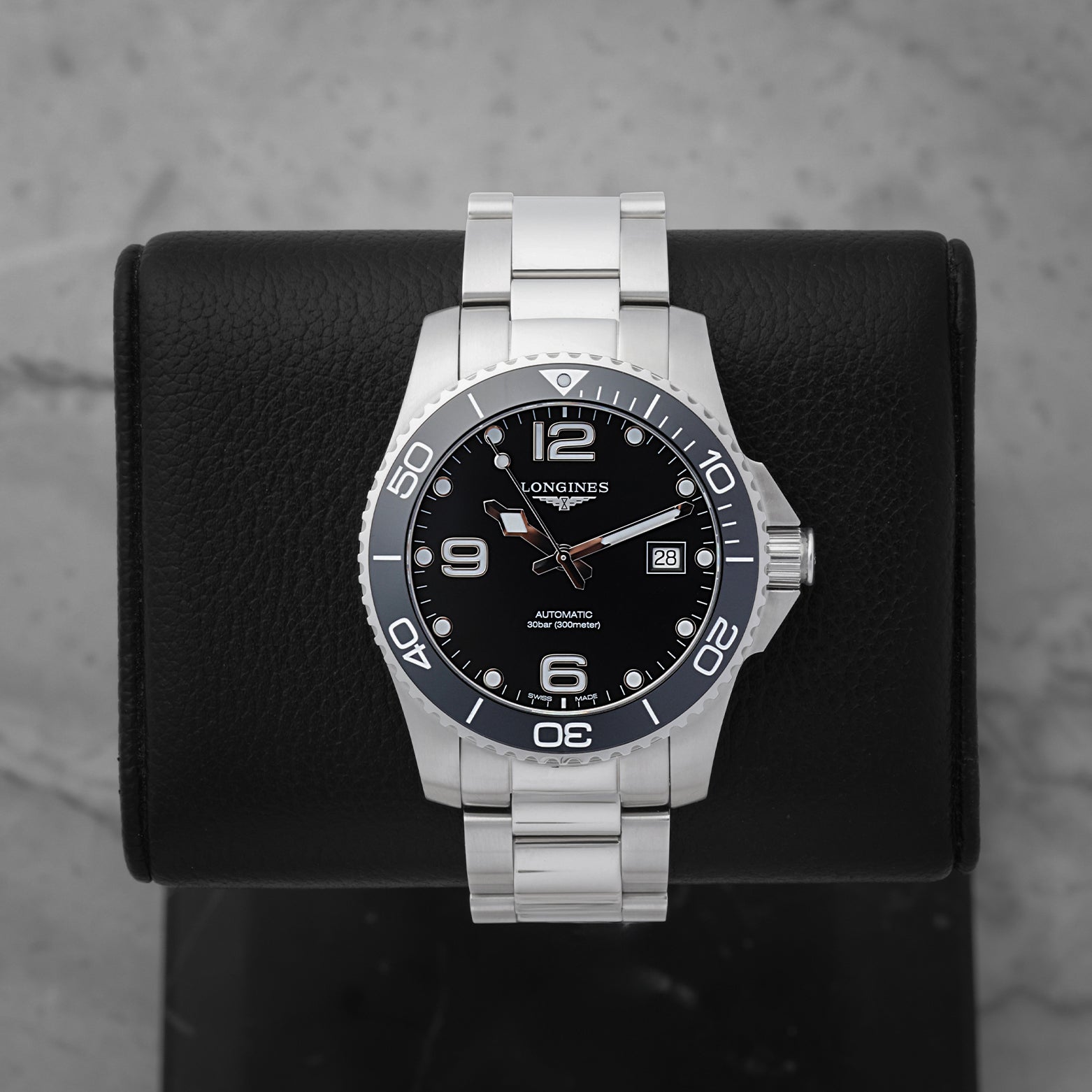 2026 Longines HydroConquest Automatic 41mm watch L3.781.4.56.6 with a black dial and ceramic bezel on a black display stand