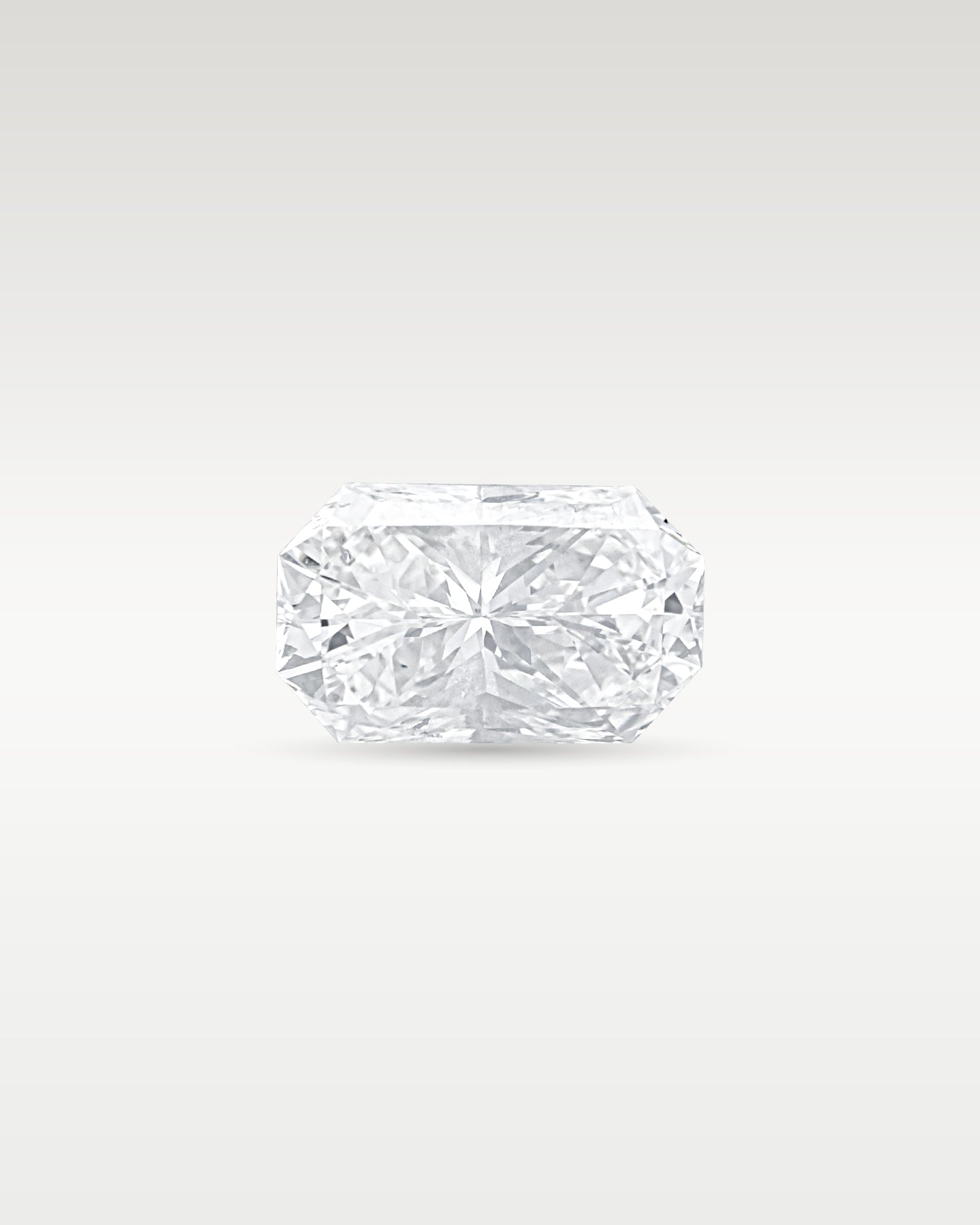 Side profile view of a loose 3.17 carat radiant cut diamond highlighting facet depth and brilliance