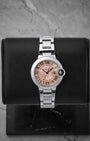 Cartier Ballon Bleu de Cartier watch with a pink guilloche dial Roman numerals and a stainless steel bracelet