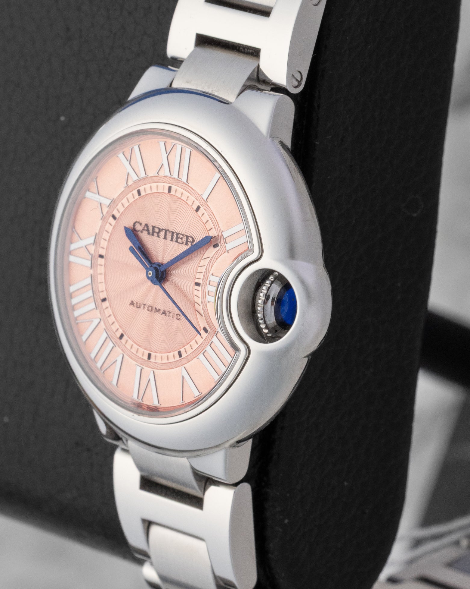 Cartier Ballon Bleu de Cartier watch with a pink guilloche dial Roman numerals and a stainless steel bracelet