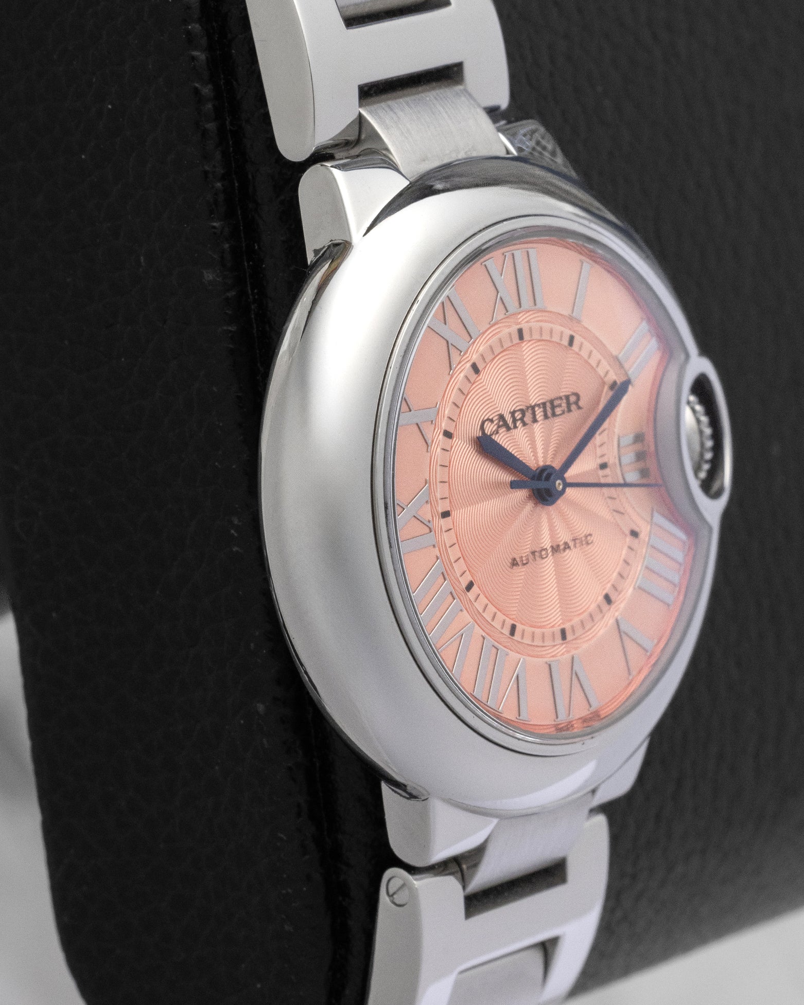 Cartier Ballon Bleu de Cartier watch with a pink guilloche dial Roman numerals and a stainless steel bracelet