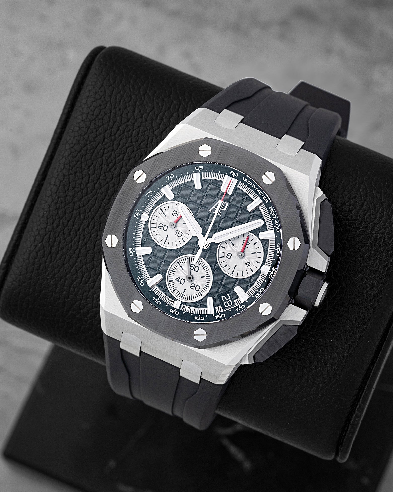 Angled view of AP Royal Oak Offshore 26420SO showing black Méga Tapisserie dial, silver sub-dials, and black ceramic octagonal bezel