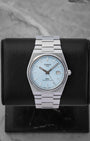 Tissot PRX Powermatic 80 watch with an ice blue waffle dial integrated stainless steel bracelet and date window