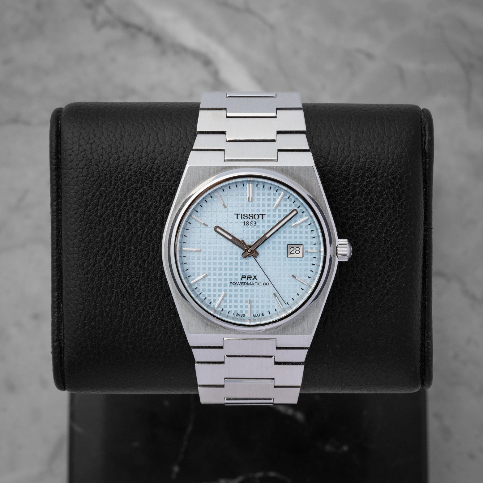 Tissot PRX Powermatic 80 watch with an ice blue waffle dial integrated stainless steel bracelet and date window